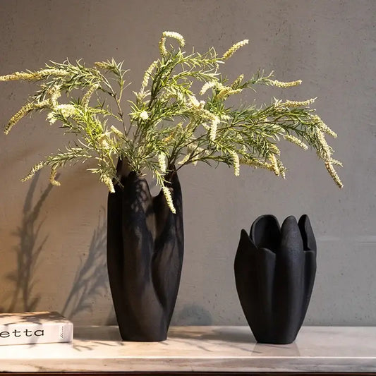 Two matte black irregular pleated ceramic vases with organic petal-like contours for living room decorbites decor