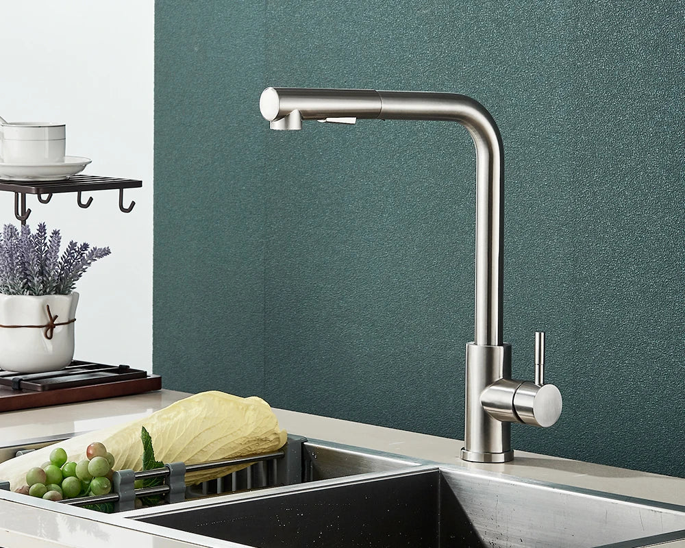 Modern brushed stainless steel deck mounted kitchen faucet with sleek curved spout and single hole pull-down spray head