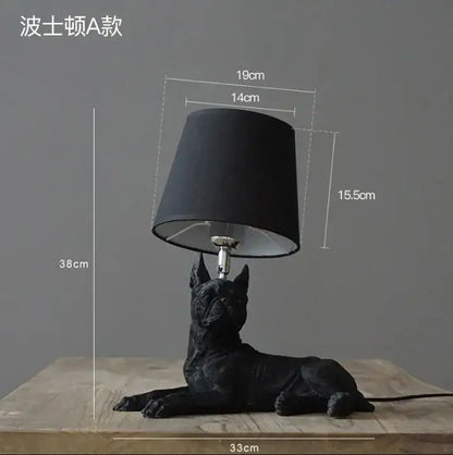 Matte black puppy dogs table lamp with a sleek black cylindrical shade for bedroom decor