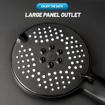 Matte black pressure boost shower head with hose showing black circular head with white perforations and mounting holes