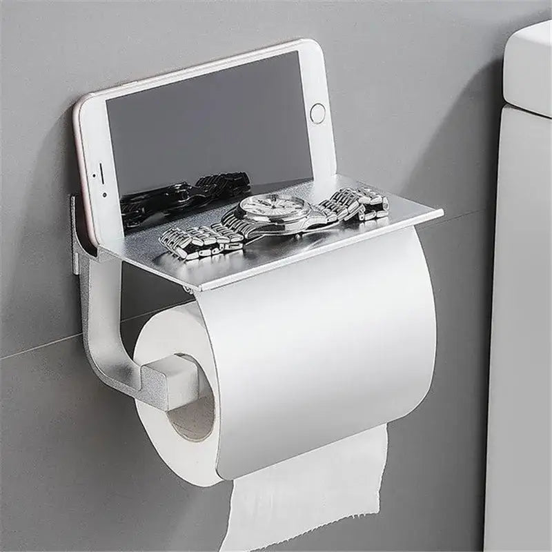 Matte black and silver metallic toilet paper holder with built-in shelf for smartphone and watch bathroom storage