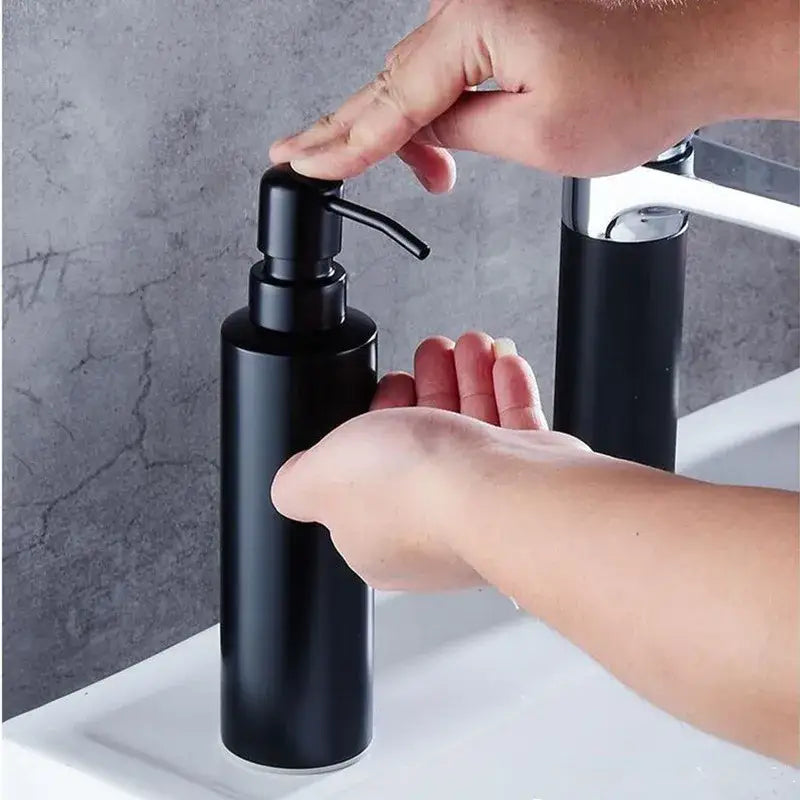 Matte black stainless steel soap dispenser with sleek cylindrical body and modern pump for bathroom decorbites black stainless