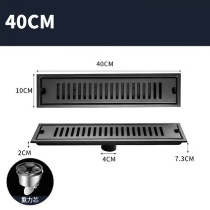 Matte black stainless steel strip floor drain with slotted design and integrated gravity sump for bathroom shower