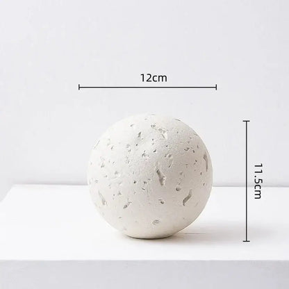 Matte blue geometric spherical home decoration accessory with textured white stone-like surface for living room decor