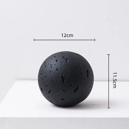 Matte black 12cm spherical lava stone with rough porous texture and natural fissures home decoration accessory