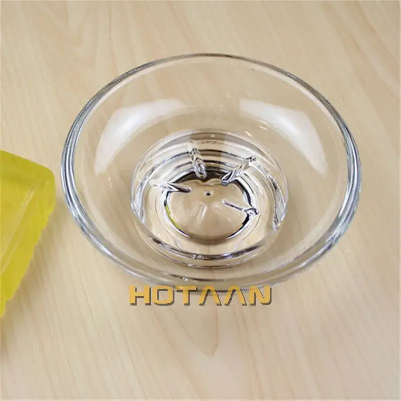 Clear glass soap dish with lid featuring a decorative etched center design bathroom accessory