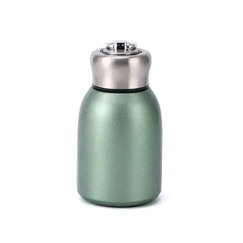 Matte sage green stainless steel vacuum flask with silver lid and black seal designed as a travel water bottle