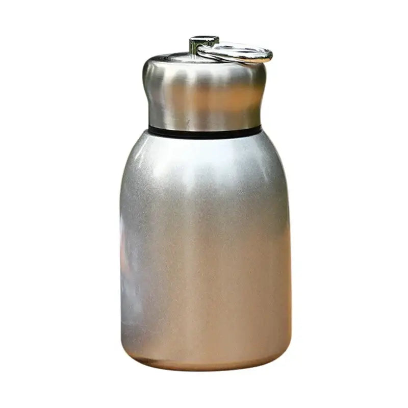 Silver stainless steel vacuum flask with insulated body and matching lid featuring integrated carrying ring water bottle