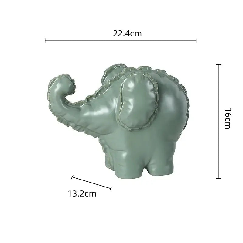 Matte sage green ceramic elephant abstract bubble sculpture with glossy finish and stitched detailing for home decor