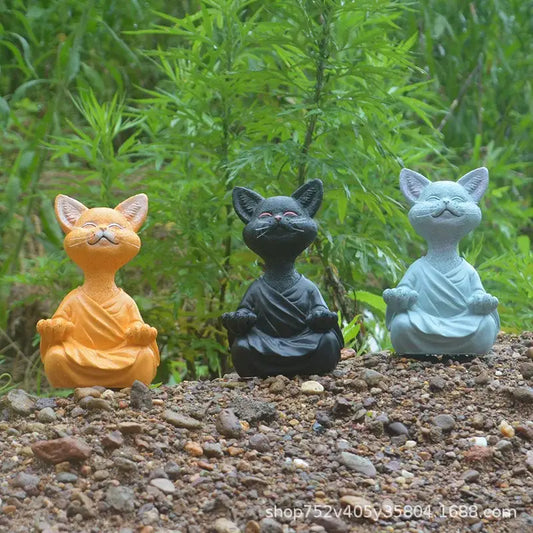 Three ceramic buddha cat figurines in orange black and light blue robes for living room decorbites black buddha decor
