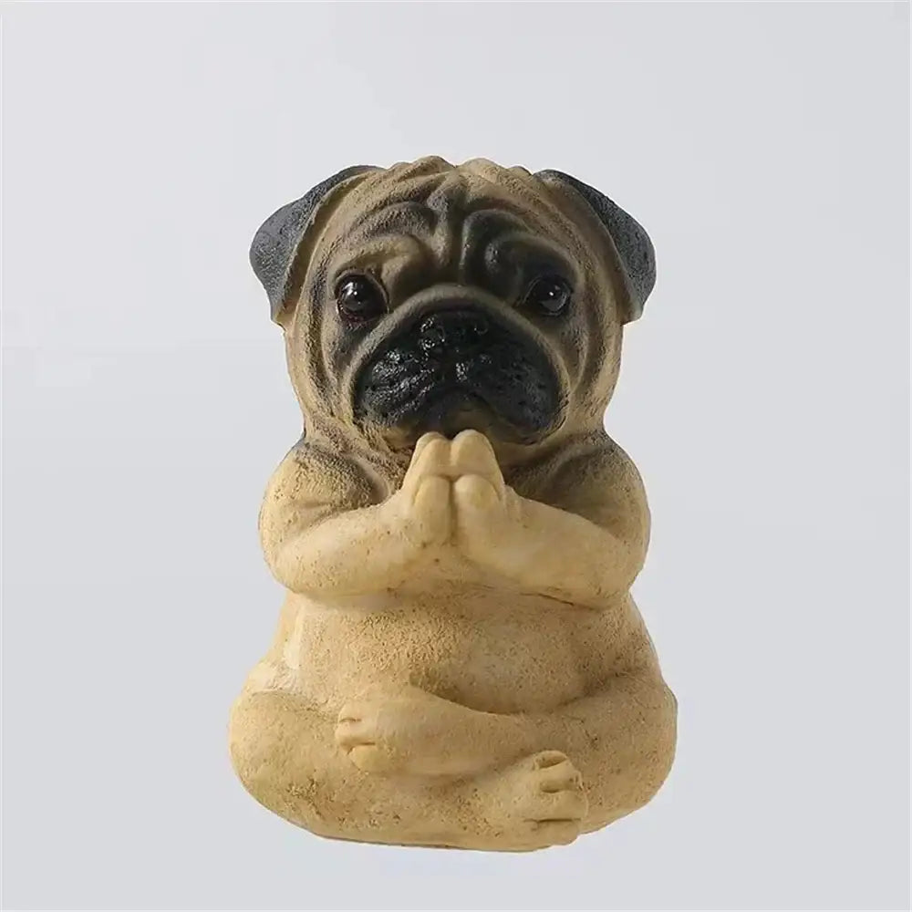 A tan and black pug bulldog resin statue in meditative pose with clasped paws from decorbites bulldog resin set