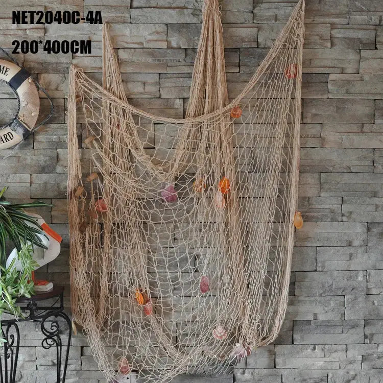 Mediterranean beige decorative fishing net wall hanging with colorful seashells and dried orange slices for living room decor