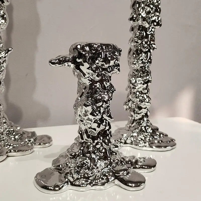 Shiny silver candlestick holder with molten-metal texture featuring sculptural irregular surfaces for decorbites golden candlestick decor