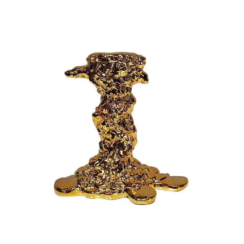 Golden candlestick holder with molten metal texture and flowing contours from decorbites for dining room decor