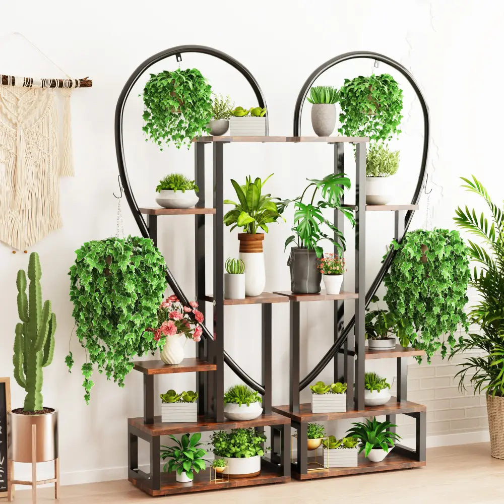 Decorbites 6-tier half heart metal plant stand in black metal and wood with multiple shelves holding potted plants