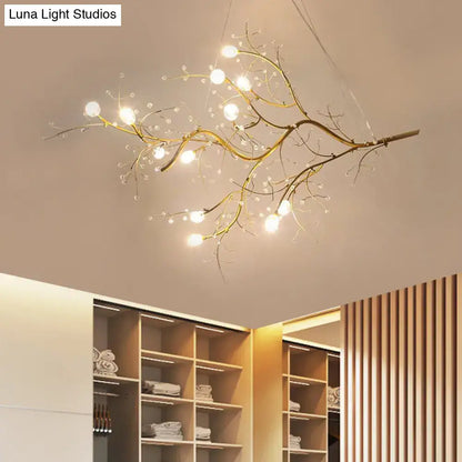 Golden branch chandelier with clear crystal bead accents and warm bulbs by decorbites situla metallic design