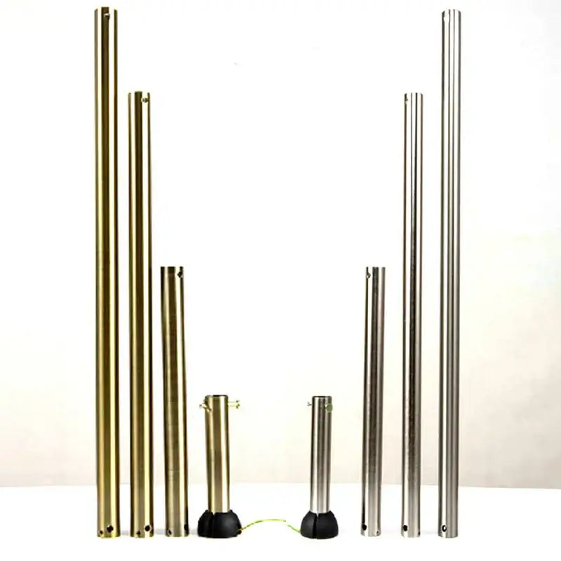 Set of metallic gold and silver poles with black bases for ceiling fan remote control bedroom extension use