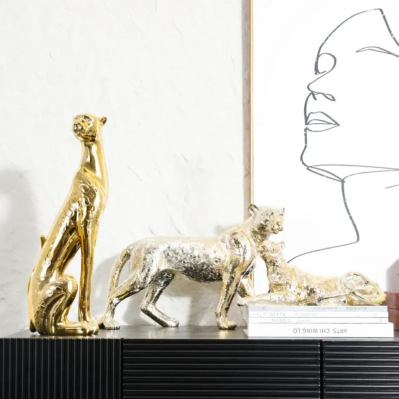 Metallic gold and silver leopard resin sculpture with textured reflective surfaces for living room decorbites leopard resin decor