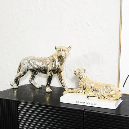 Two metallic gold and silver leopard resin sculpture figurines on white base for living room decorbites leopard resin decor