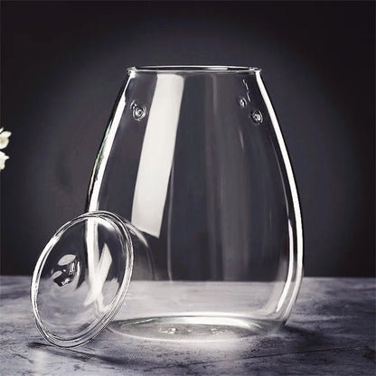 Clear glass tea infuser with matching lid and embossed circular details for micro landscape glass bottle decor