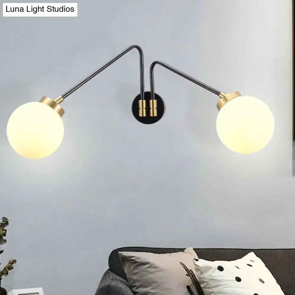 Modern double-arm wall sconce with black metal arms and gold accents, frosted opal glass globe shades for e26 e27 bulbs