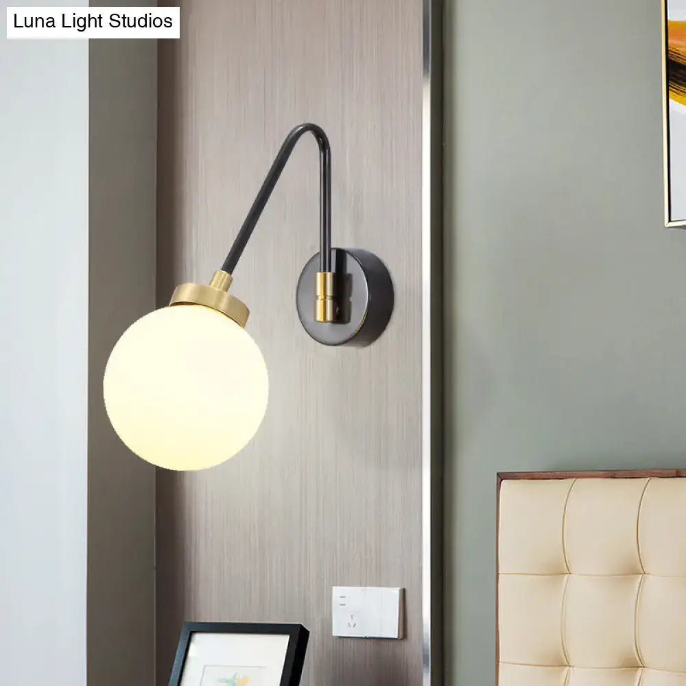 Mid century black and brass wall sconce with spherical frosted opal glass shade compatible with e26 e27 bulbs