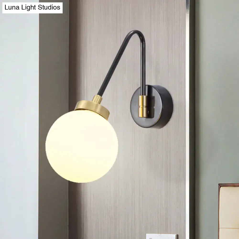 Modern black and brass mid century wall sconce with spherical frosted opal glass globe compatible with e26 e27 bulbs