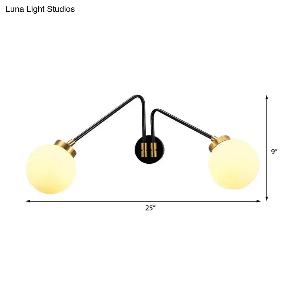 Black and brass two-arm mid century wall sconce with frosted opal glass globes compatible with e26 e27 bulbs