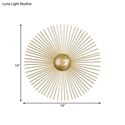 Mid century brass sunburst sconce light fixture with gold-toned metal orb and radiating spokes for living room wall