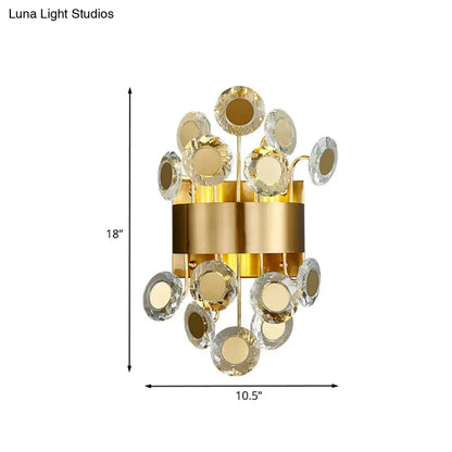 Mid century gold crystal wall light with integrated led features a cylindrical base with faceted crystal discs floral design