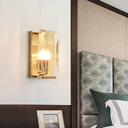 Mid century gold wall sconce with rectangular frame clear glass crystal shield and bulb base for living room lighting