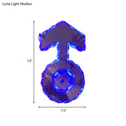 Minimal chrome faceted crystal boy logo wall lighting in translucent blue shaped like a male gender symbol