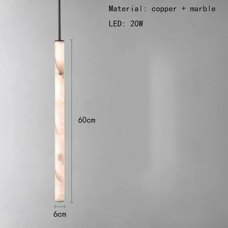 Minimalist amber marble and black pendant light with cylindrical body and polished copper accents for lighting area