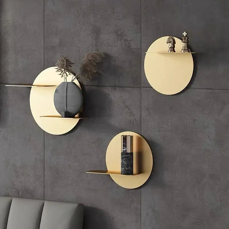 Minimalist beige round metal wall storage shelf with gold circular design mounted on dark gray walls for living room storage shelf