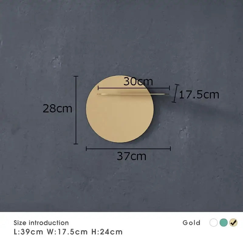Gold circular wall-mounted mirror with sleek metallic frame complements minimalist beige round metal wall storage shelf