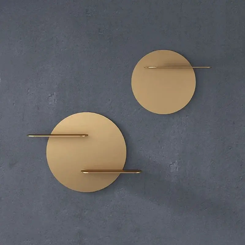 Gold-toned circular metal wall storage shelf with minimalist design and slender horizontal bars for living room wall storage