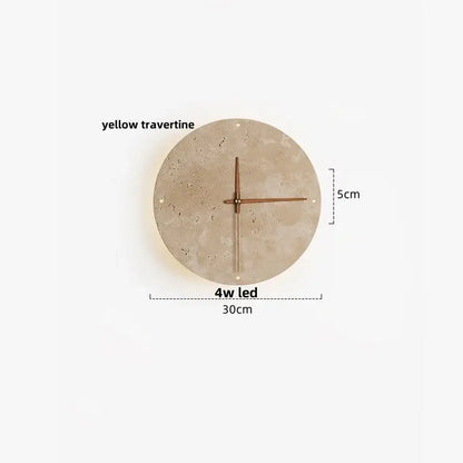 A minimalist beige travertine wall clock with yellow face and bronze hands complements led wall lights for bedroom decor