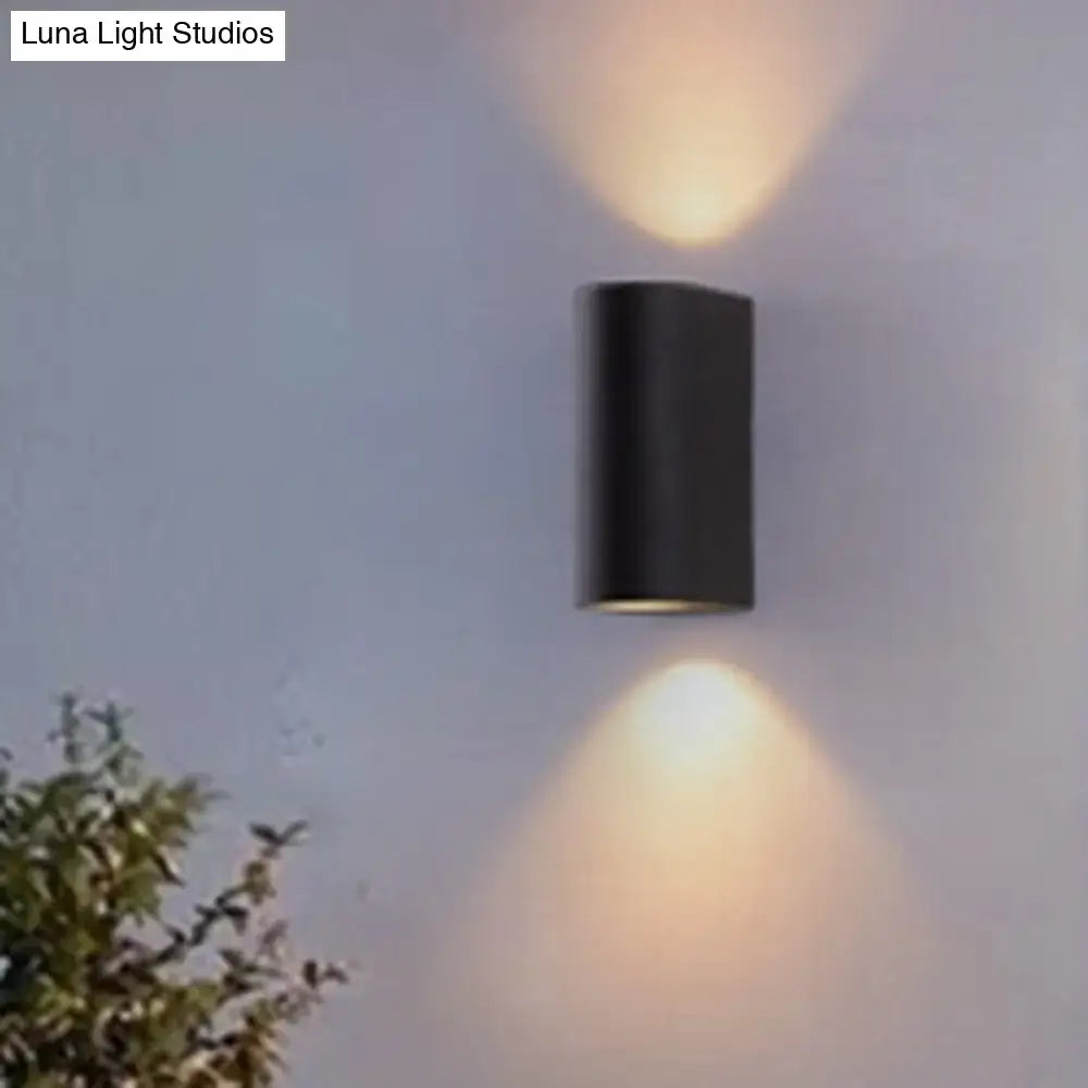 Minimalist black aluminum outdoor wall light with two downward-facing lights for direct wired electric outdoor space