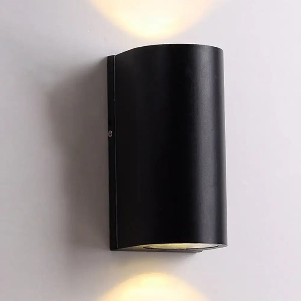 Minimalist black aluminum outdoor cylinder wall light with dual beams for direct wired electric outdoor space lighting