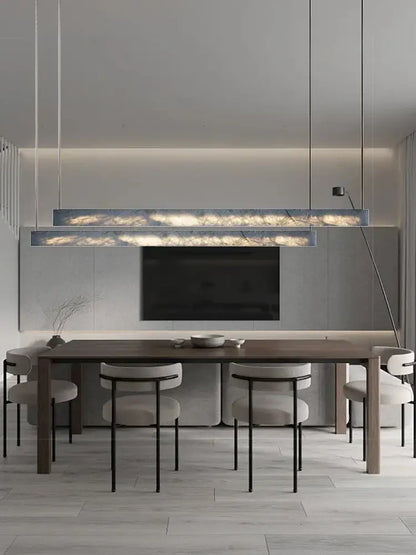 Minimalist black and amber marble design pendant light with warm internal lighting for office use