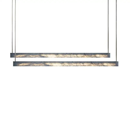 Minimalist black and amber marble design pendant light featuring sleek metal frames for modern office lighting