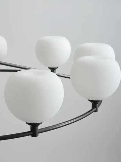 Minimalist black and copper glass chandelier with frosted white globe shades for dining room decorbites copper glass design