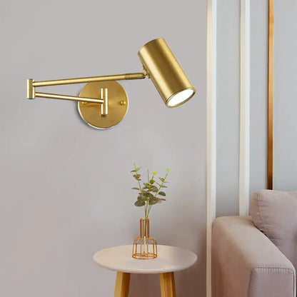 Gold finished black gold adjustable wall-mounted cylinder reading lamp with articulated arm for minimalist bedroom use