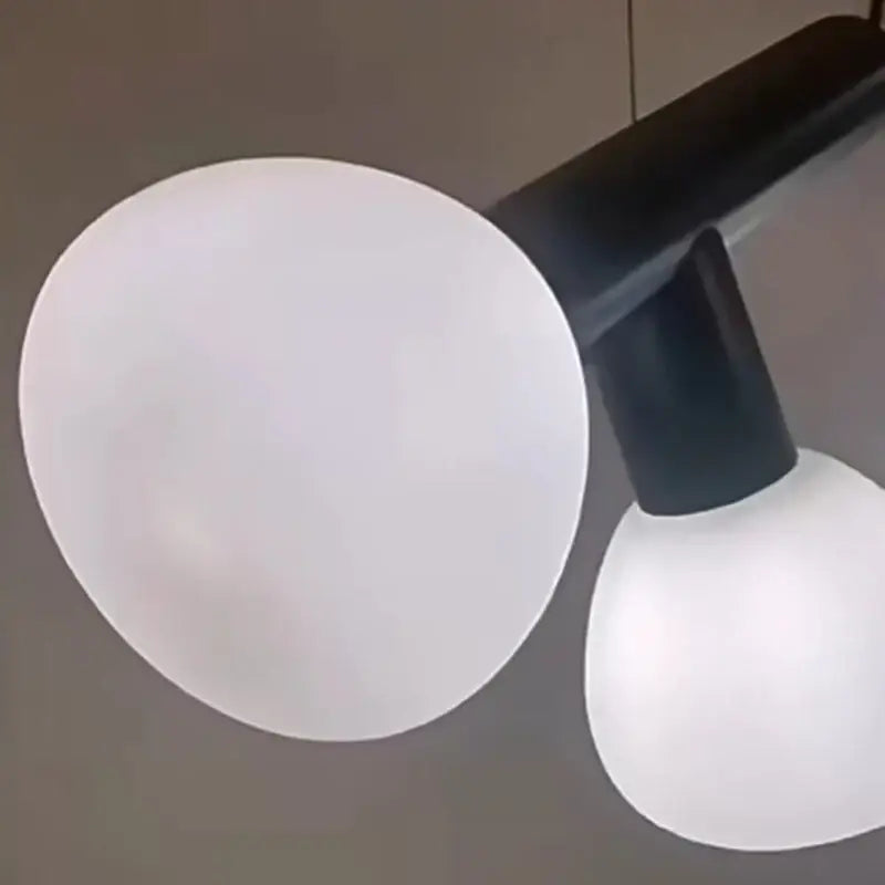 Minimalist black and white glass pendant lights with two frosted spherical shades for dining room pendant light