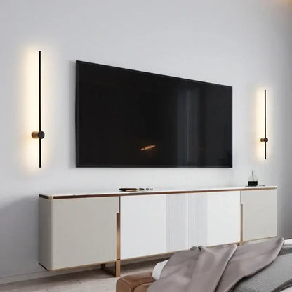 Minimalist black and brushed brass led wall lamp featuring vertical light bars for modern living room lighting