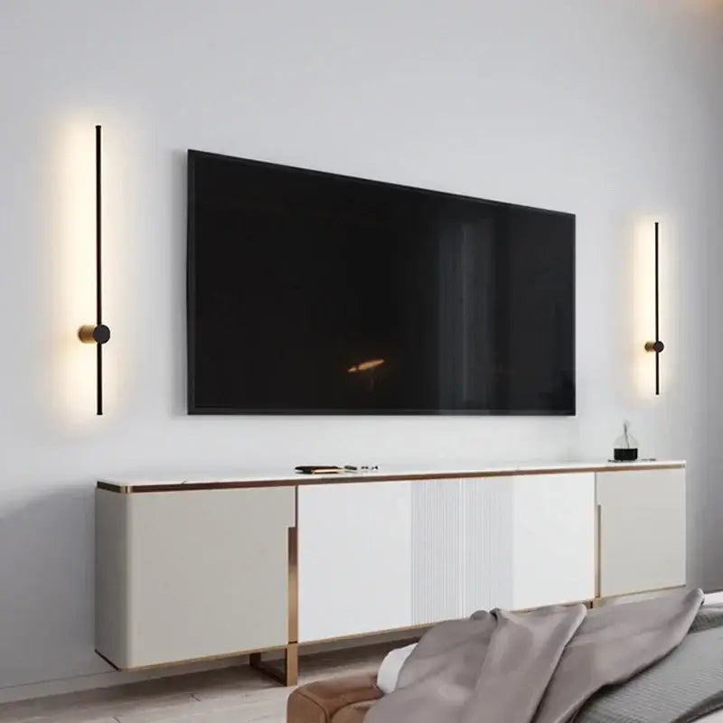 Minimalist black and brushed brass led wall lamp featuring vertical light bars for modern living room lighting
