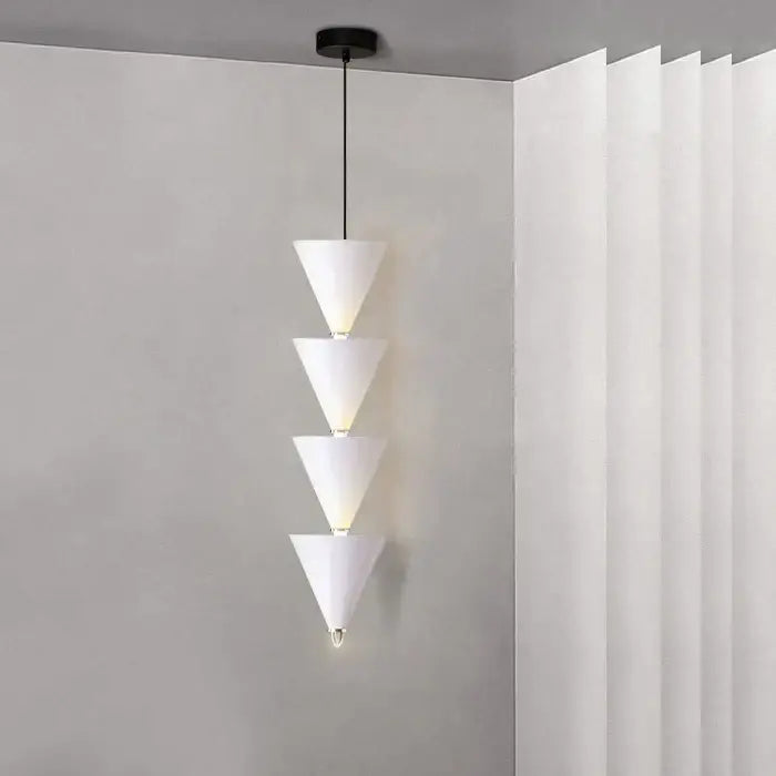 Minimalist black conical pendant light with four cream illuminated segments for decorbites cream bedroom chandelier