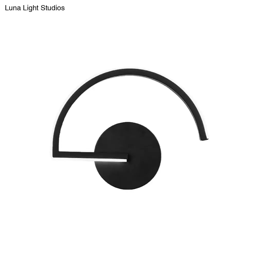 Minimalist black curved wall mounted lighting sconce with sleek arm and circular base for bedroom mounted lighting