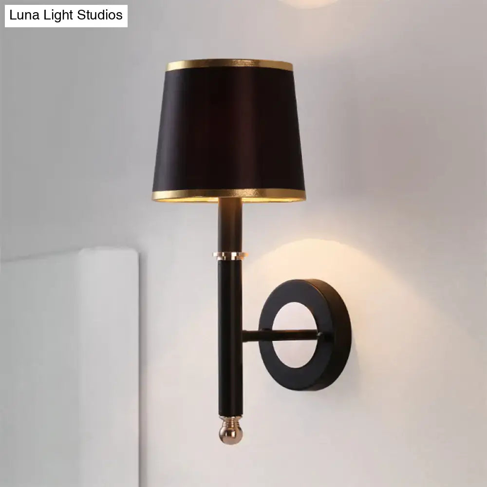 Black flaxen sconce light with gold-trimmed lampshade and polished brass accents for 110v-120v 220v-240v use