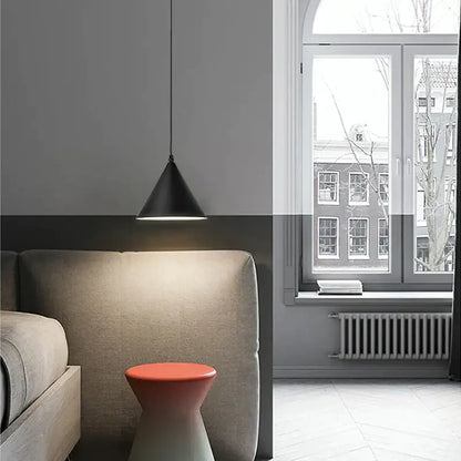 Minimalist black geometric led pendant light with sleek conical design hanging above bed for modern decorbites pendant light decor